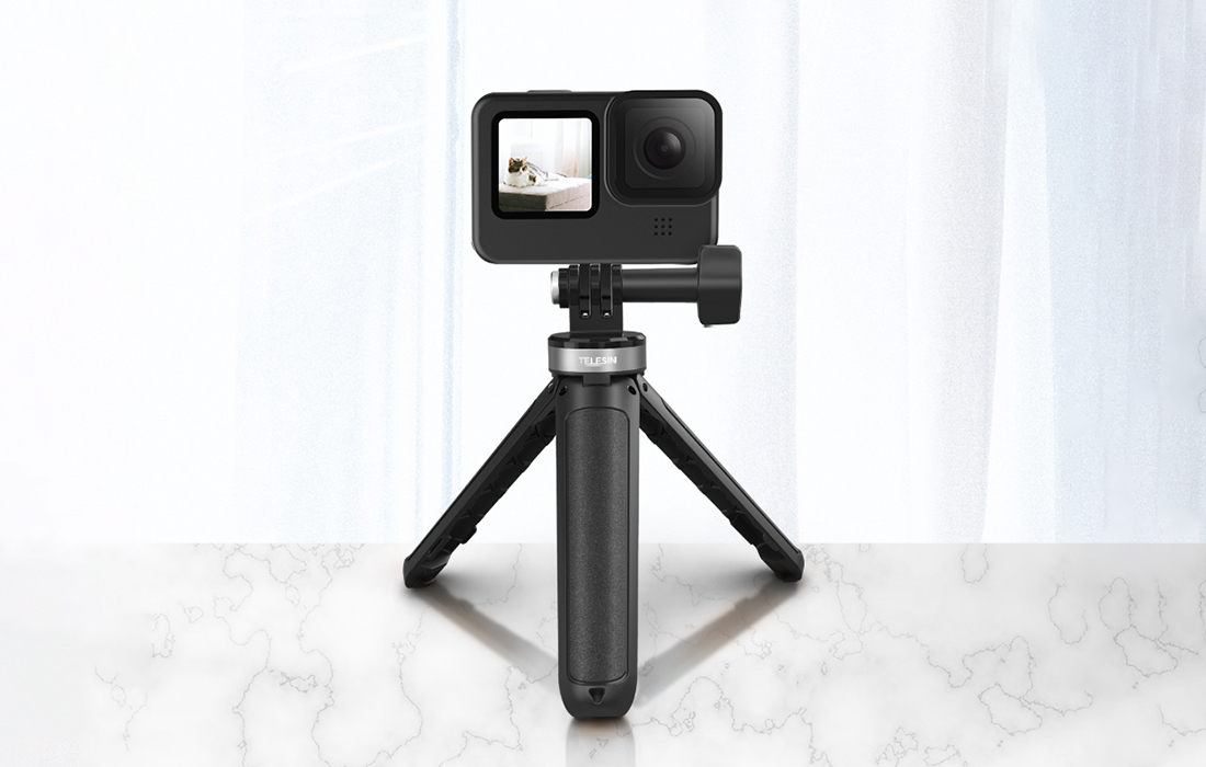 Tripod with sports camera mounted