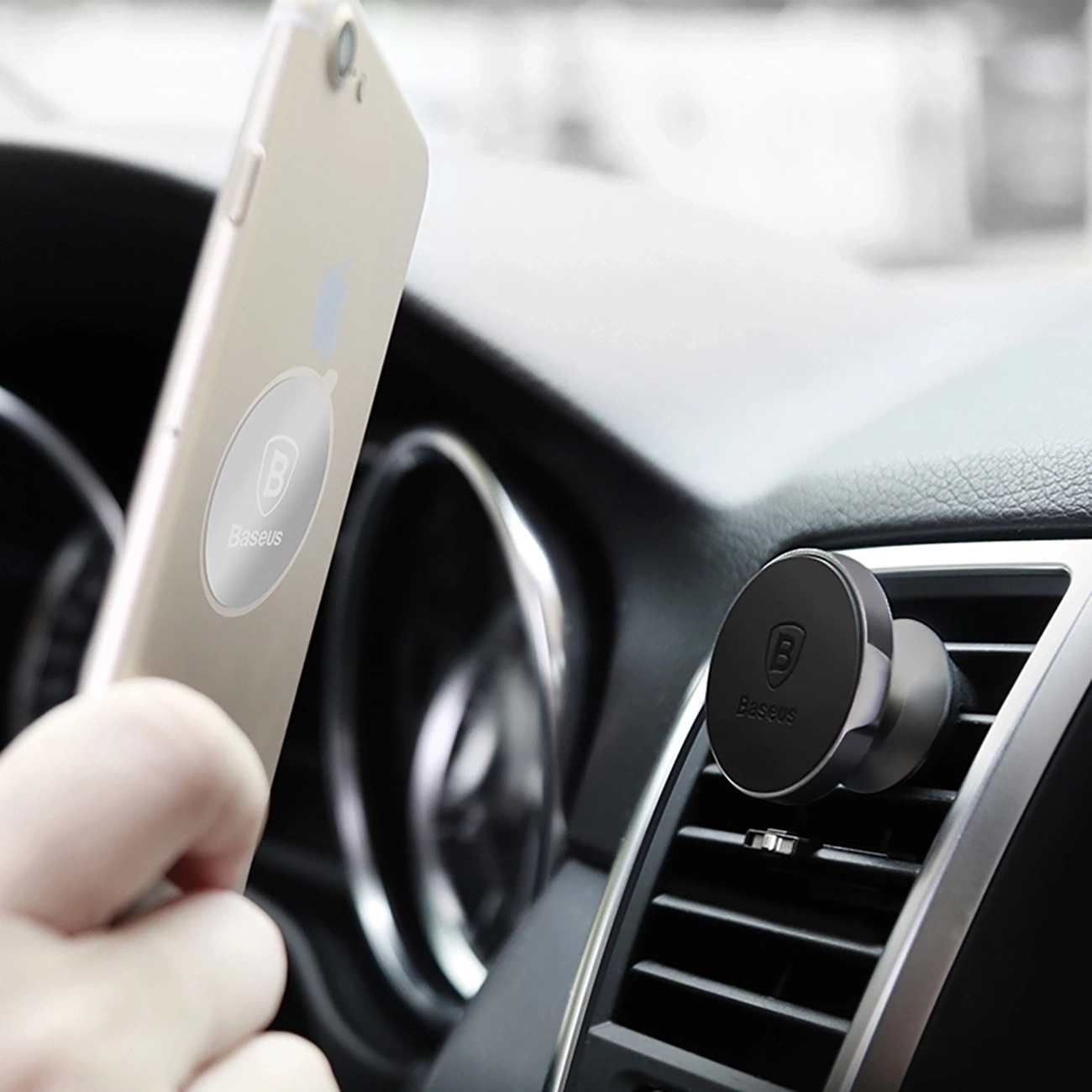 Holder with phone magnetically attached in car air vent