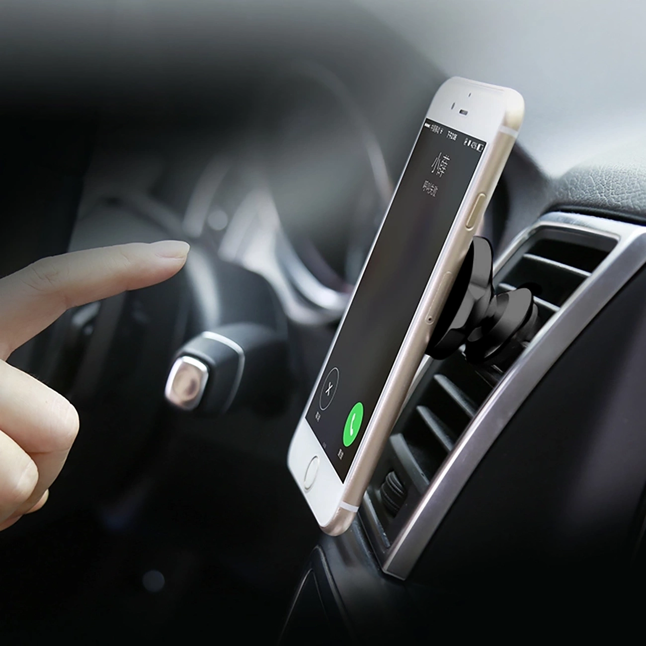 Driver answers a call on a phone attached to Baseus Small Ears holder