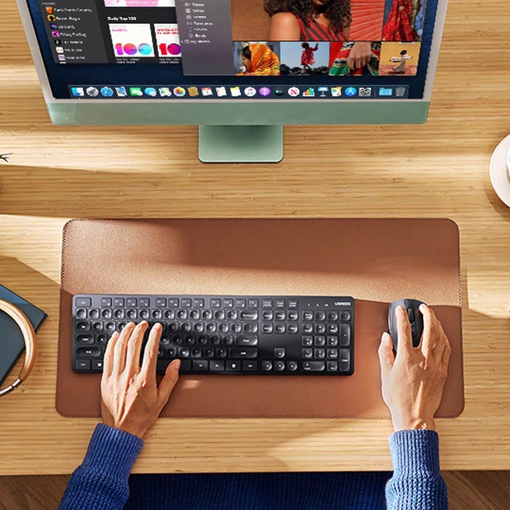 A man uses a Ugreen KU004 wireless keyboard