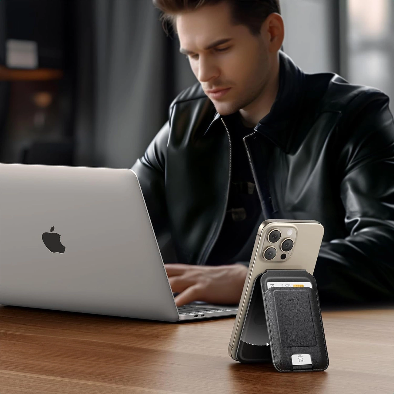 Phone rested on a desk with Ugreen Magnetic Wallet 45165