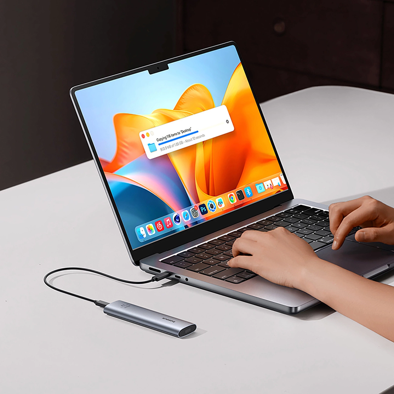 Laptop connected to Baseus FlyJoy M.2 SSD pocket