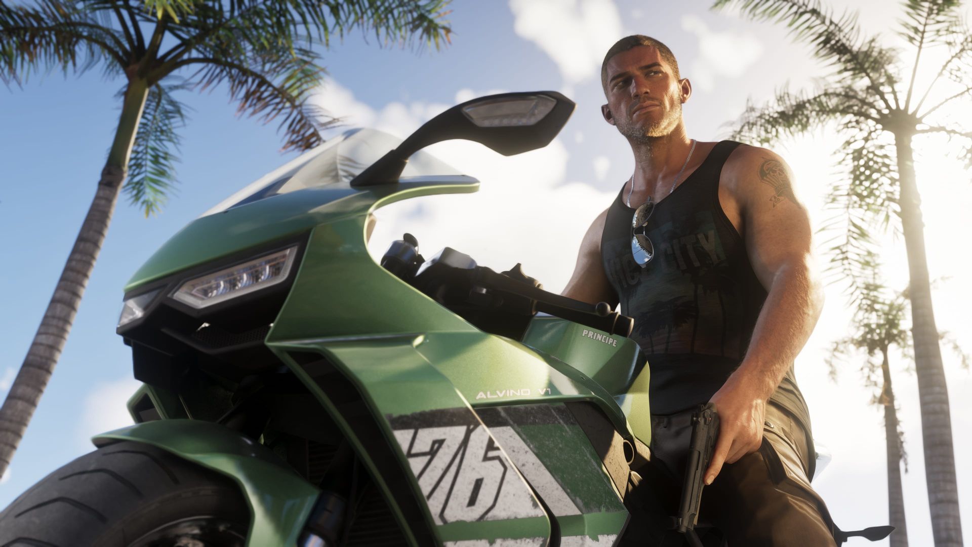 Jason Duval standing beside a green motorcycle