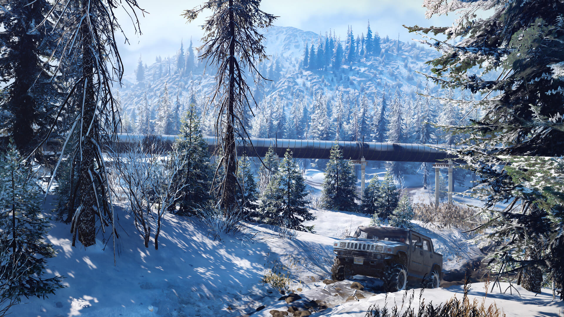 SnowRunner off-road vehicle travelling through a snowy mountain environment
