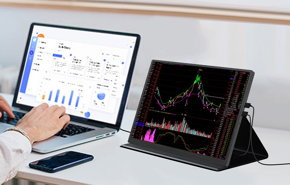 ZEUSLAP Z10P portable monitor connected to a laptop and displaying financial charts