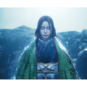 Female ally in traditional dress in a dramatic mountain landscape